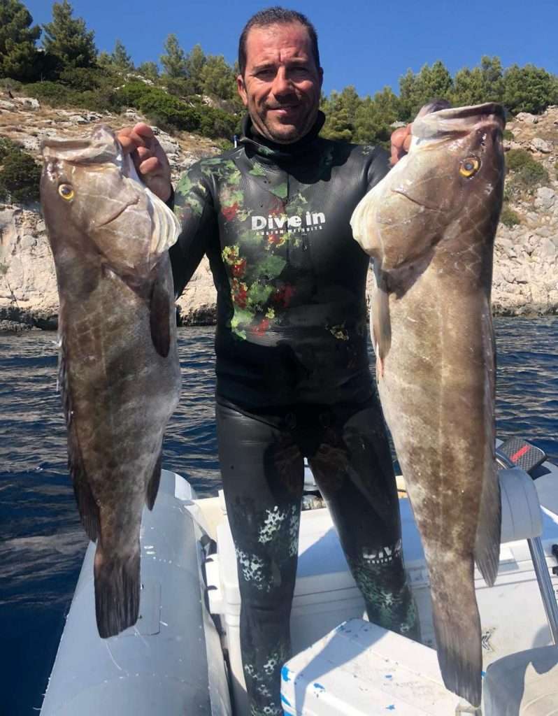 Antonio Buratovic with two great white groupers