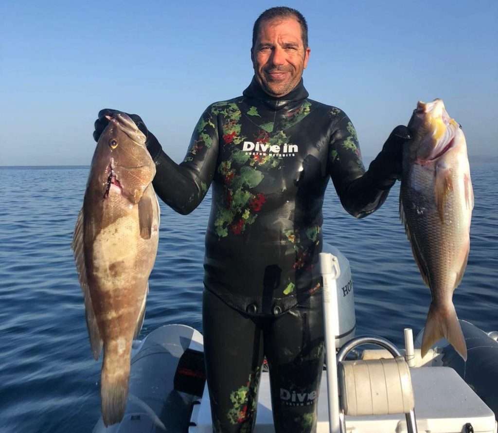 Antonio Buratovic with a white grouper and a dentex