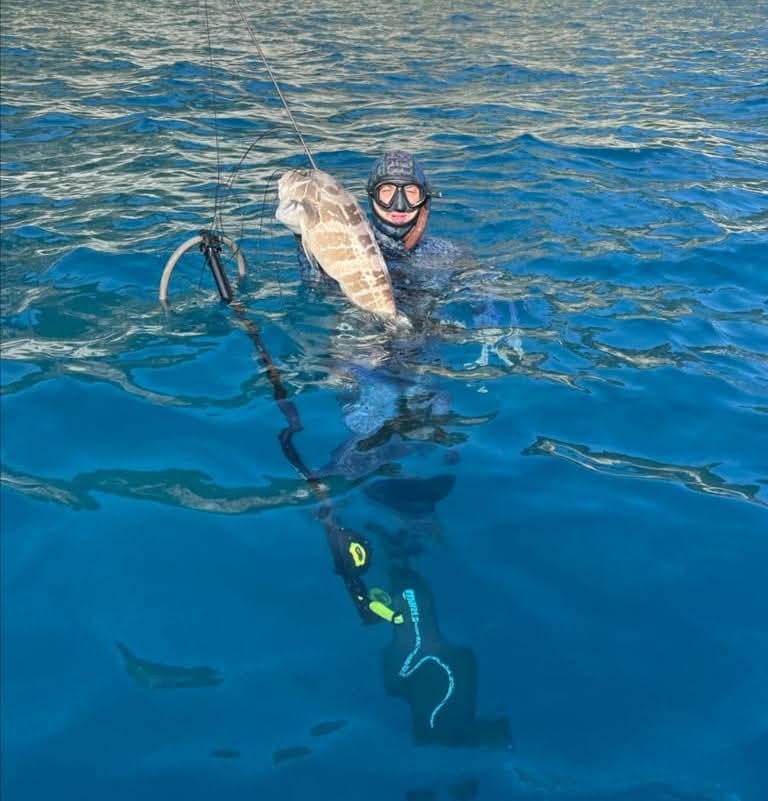 Luca con una bianca appena catturata